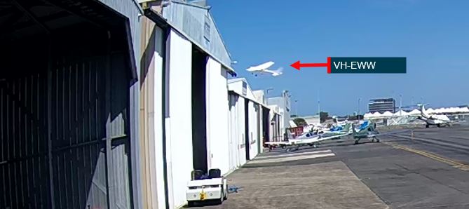 Figure&nbsp;6: Image from CCTV footage showing VH-EWW passing close above hangars