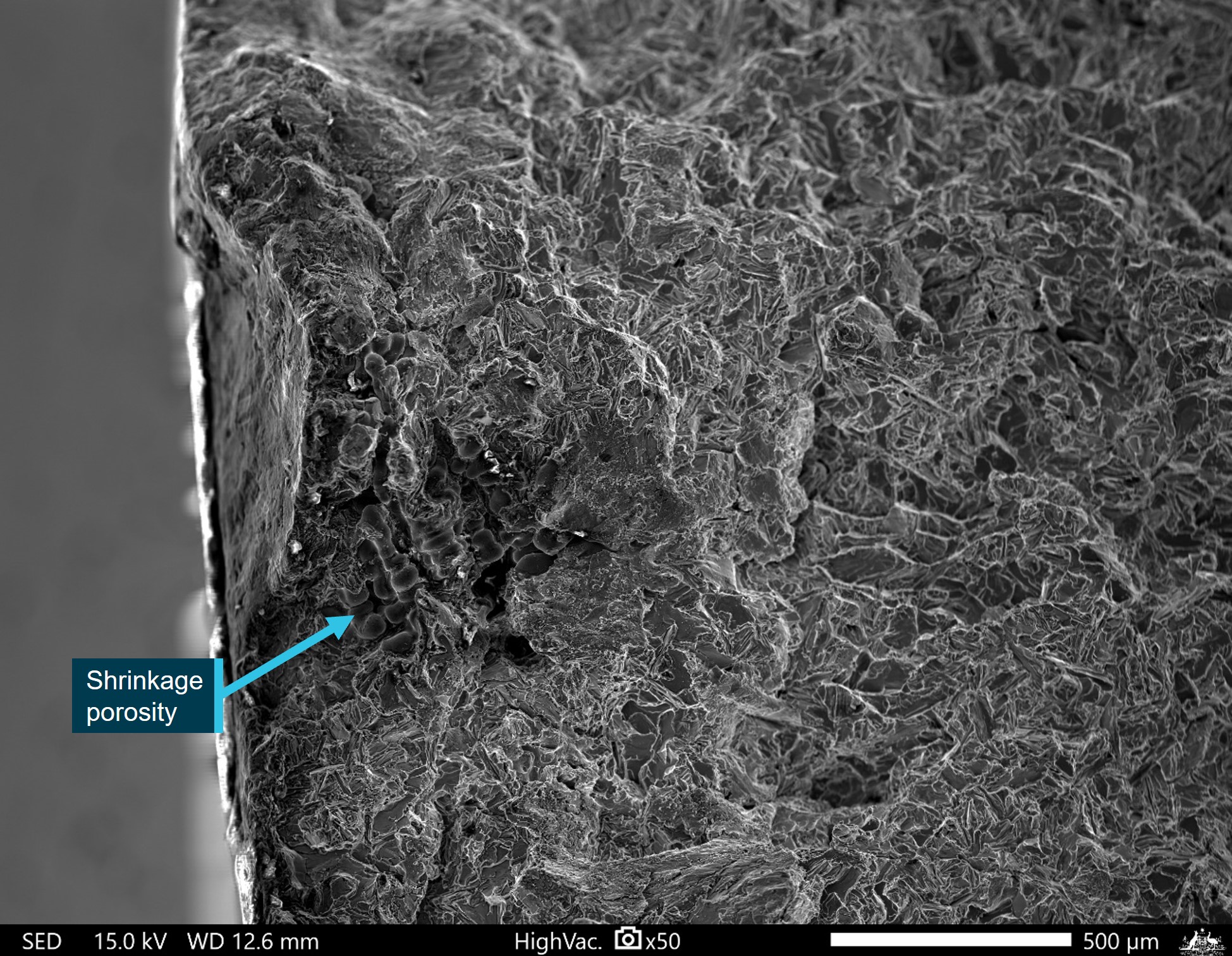 Figure&nbsp;19: SEM micrograph of an example defect in the aft bulkhead fracture surface where subsurface shrinkage porosity was identified