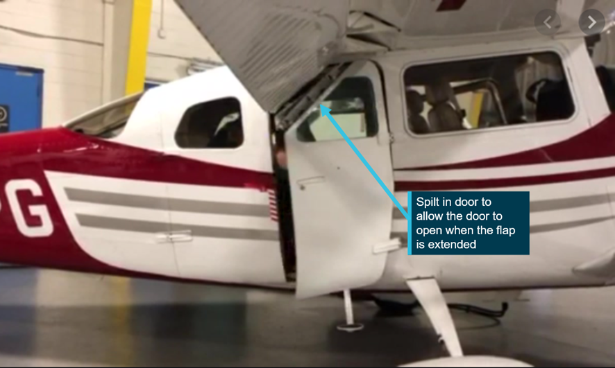Cessna 206 showing the approved modified forward cargo door with a hinged top part of the door allowing it to fold under the extended wing flap.