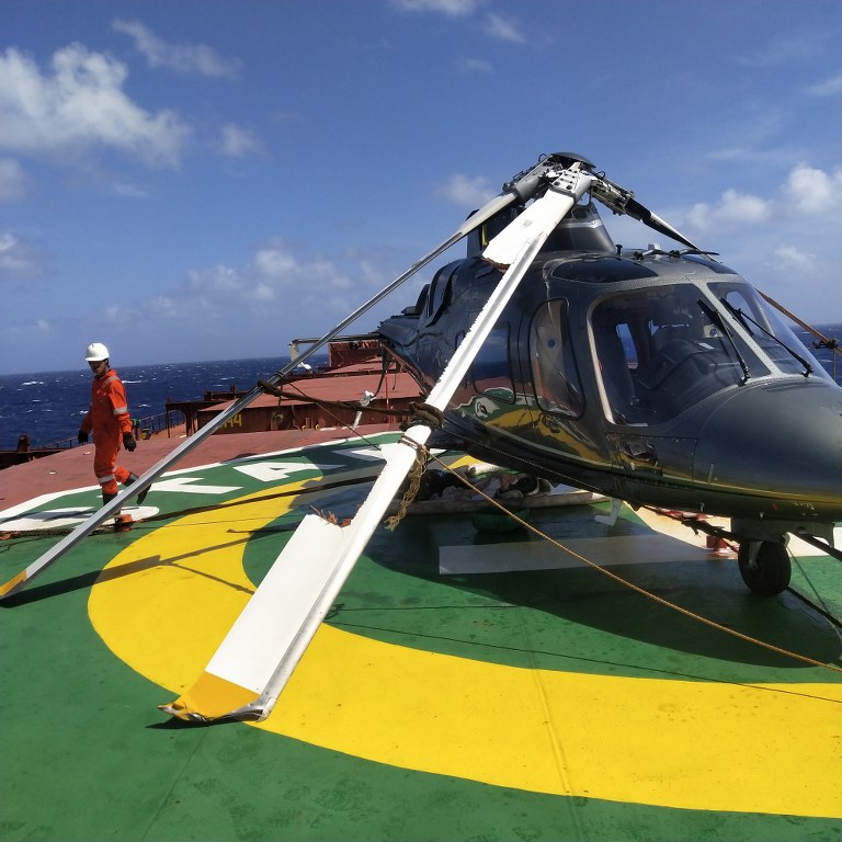 A photo of the helicopter wreckage on the deck of the bulk carrier, Star Coral