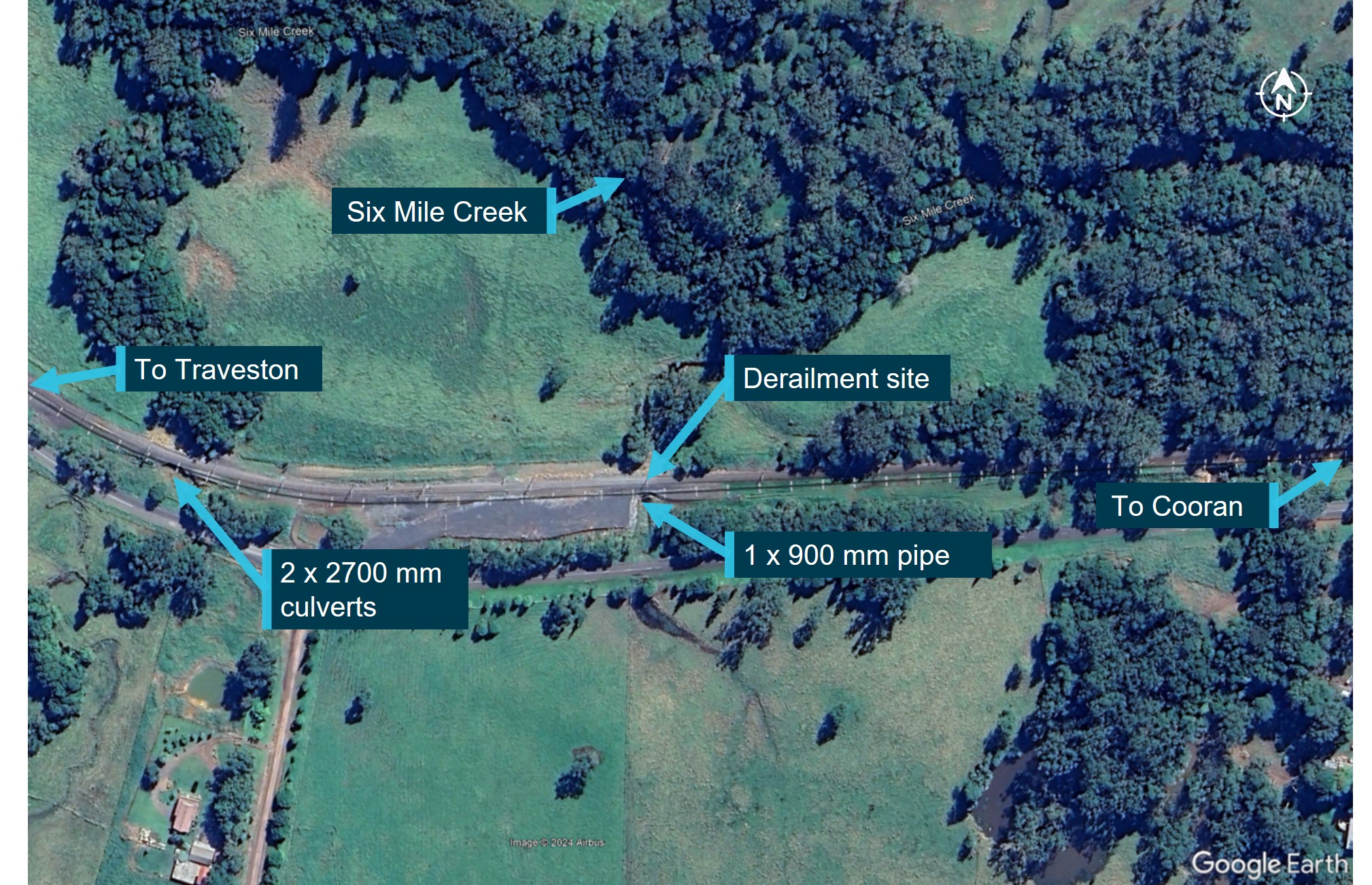 Google Earth satellite view of the derailment site at Traveston showing water courses and cross-track drainage systems.