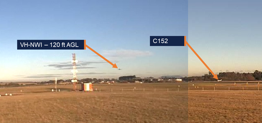 Image showing the incident aircraft on short final at 120 ft AGL approaching the C152 holding on the taxiway
