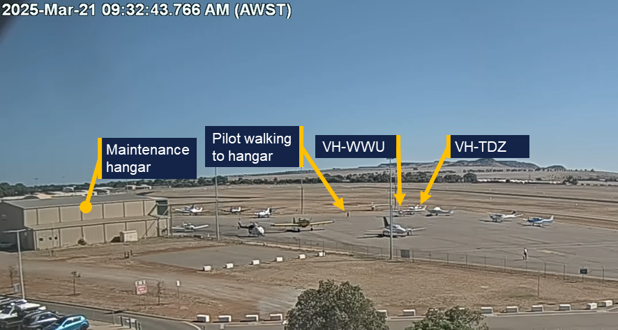 Image of the maintenance hangar and aircraft parking area from airport video footage.