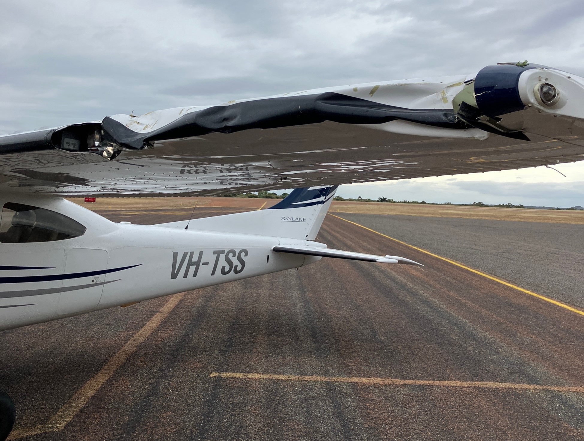 VH-TSS left wing showing significant damage due to impact with the tree 