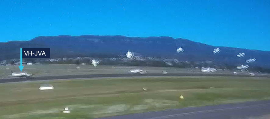 A composite still image from the recorded video of the accident flight. The image shows the left arcing flight path of VH-JVA.