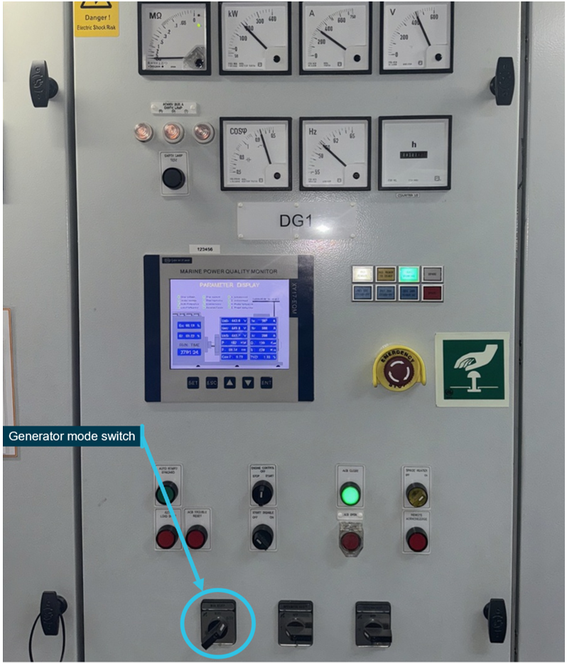 In image of one of the ship's auxiliary diesel generator control panels, showing the location of the generator mode switch 