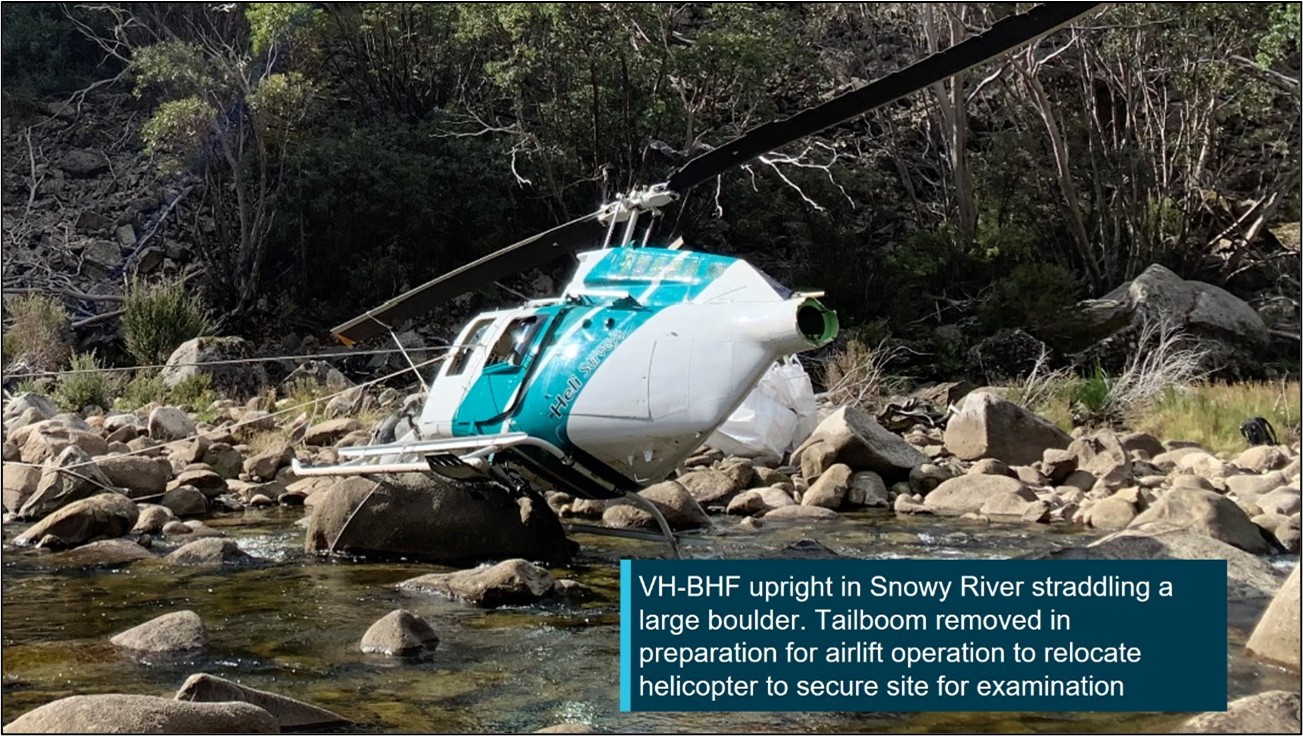 VH-BHF following the collision with terrain against a large boulder in the Snowy River, NSW