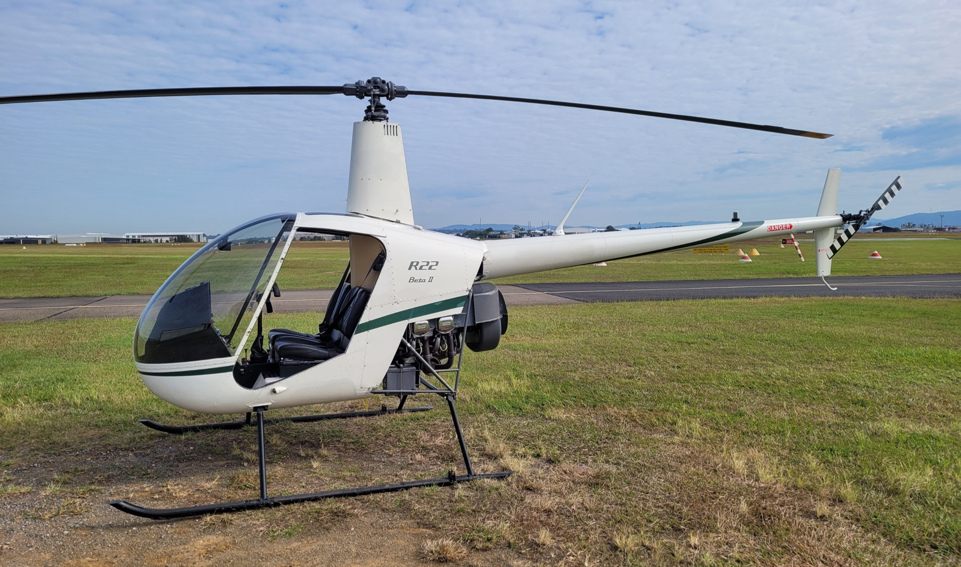 An exemplar Robinson R22 with doors removed.