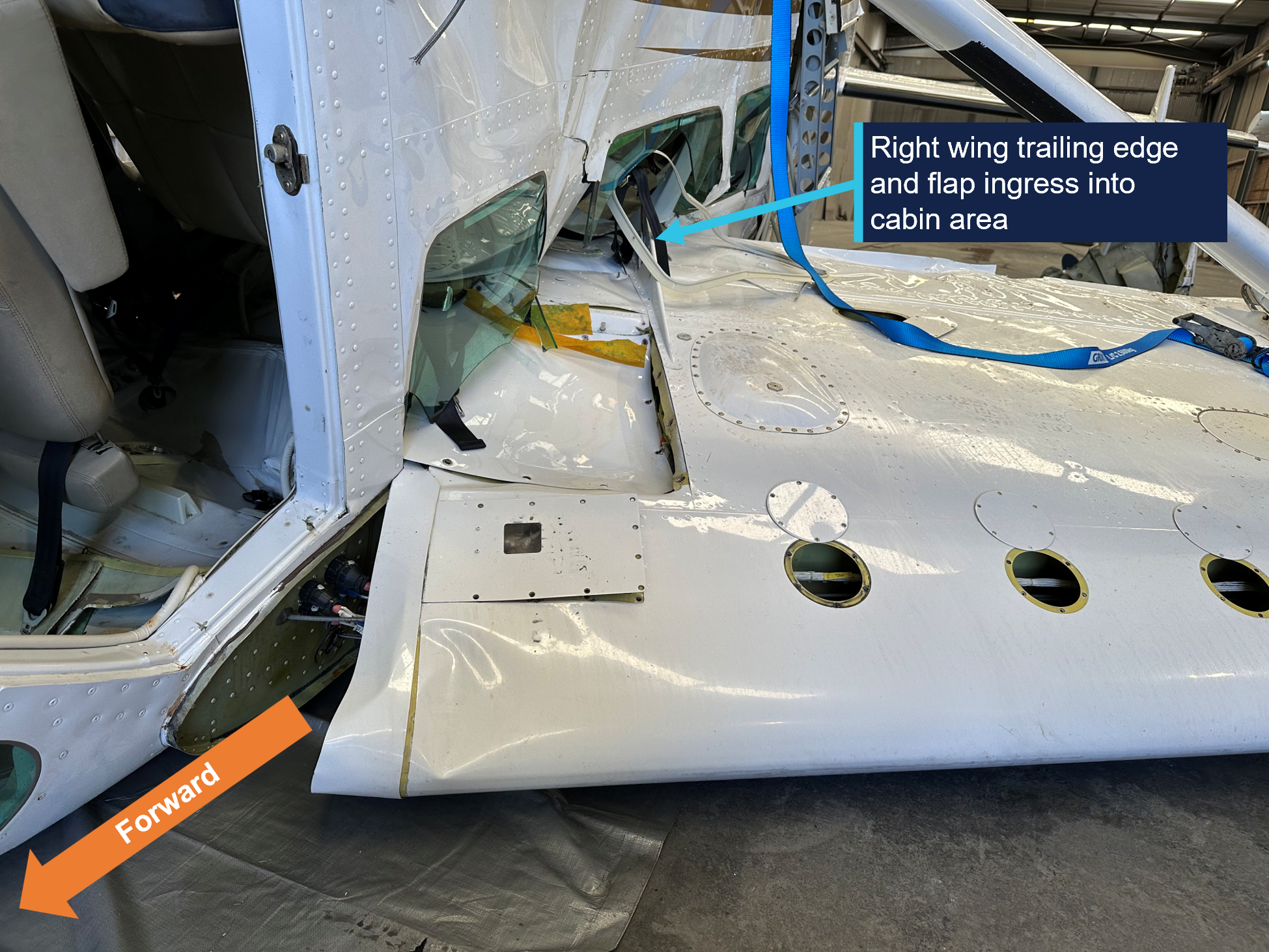 Ingress of right wing into VH-WTY fuselage. Image depicts inverted aircraft facing aft