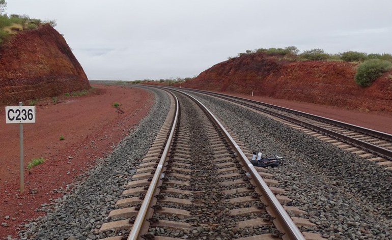 An image showing a kilometre post on an Australian railway where the kilometre was marked using a 'C' prefix, C236. 