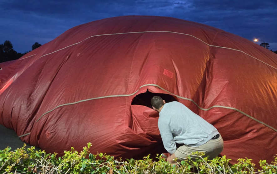 Photograph of tear in balloon envelope.
