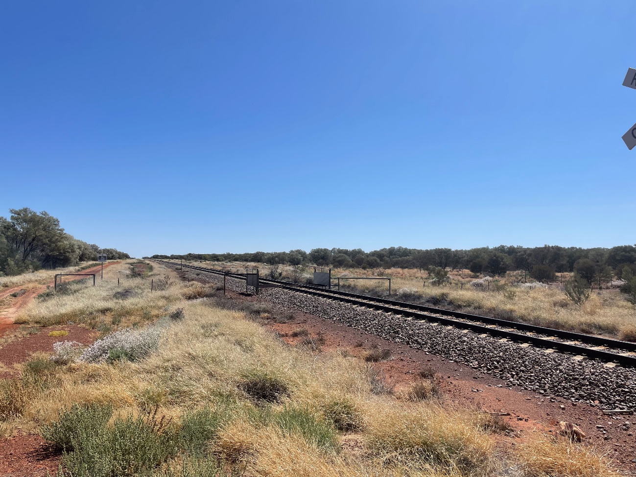 View looking north along the rail corridor from the stop line at the level crossing 