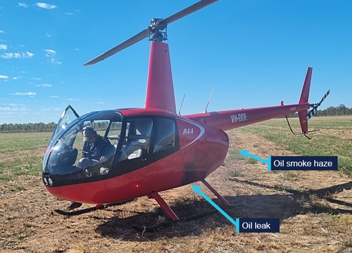 VH-OOE shortly after landing showing oil leak and smoke haze