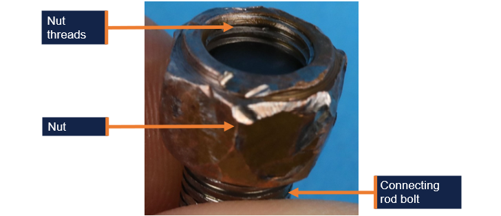 Number 4 cylinder connecting rod bolt showing position of retained nut