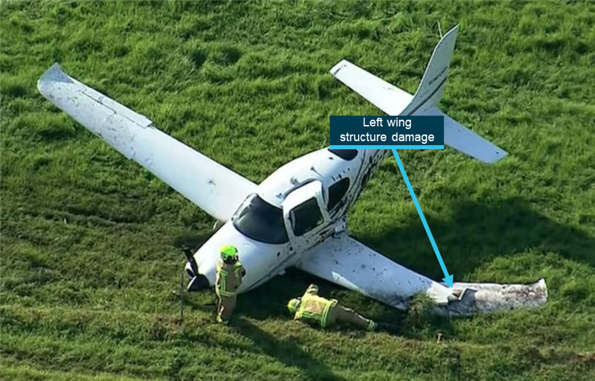 Aircraft wreckage with substantial impact damage to the left wing. 