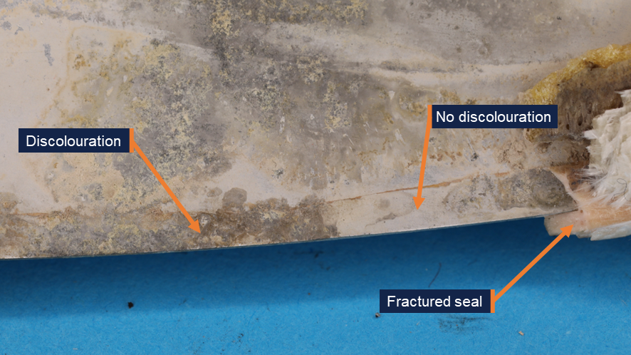 A photograph showing areas on the antenna base where discolouration and no discolouration were observed.