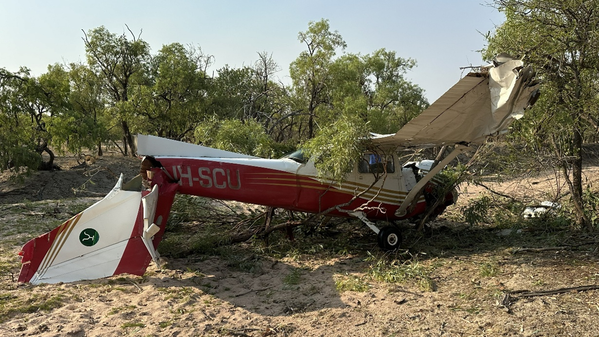 Photograph of the aircraft after the collision with terrain in an upright position with the tail separated.