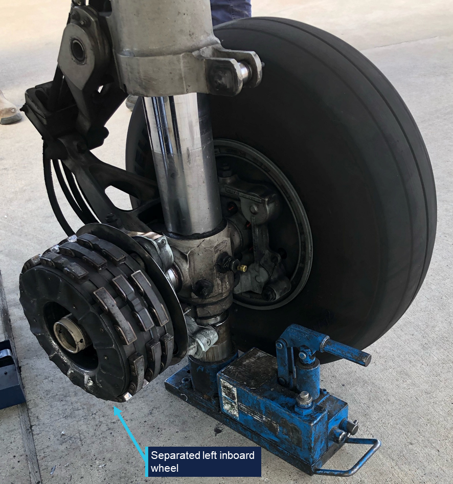 VH-VEZ left main landing gear with separated inboard wheel