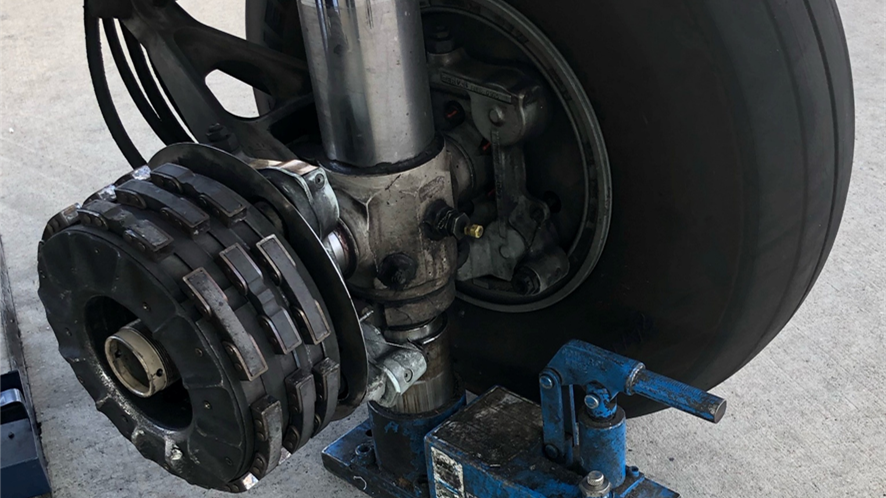 Left main gear missing wheel.