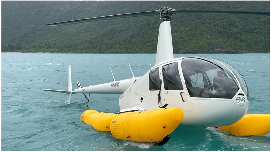 VH-8HR floating on the ocean with emergency pop-out floats inflated.