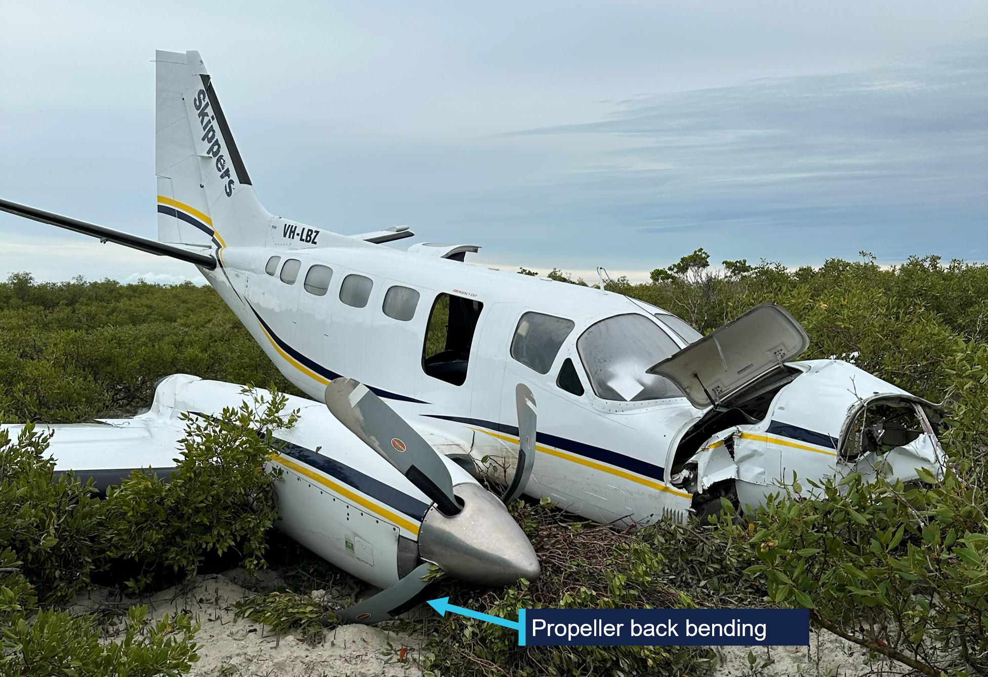 Aircraft wreckage, with a label showing the propeller back bend. 