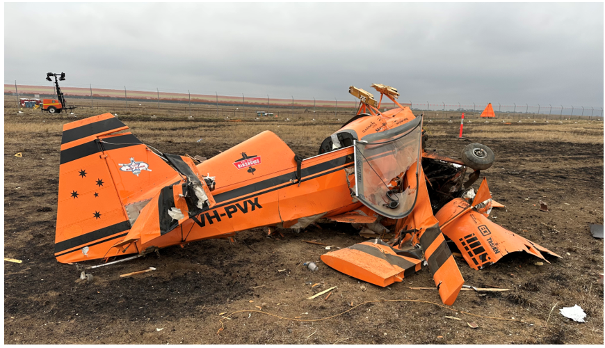 VH-PVX at the accident site, the image shows the extent of the damage resulting from the collision with terrain.