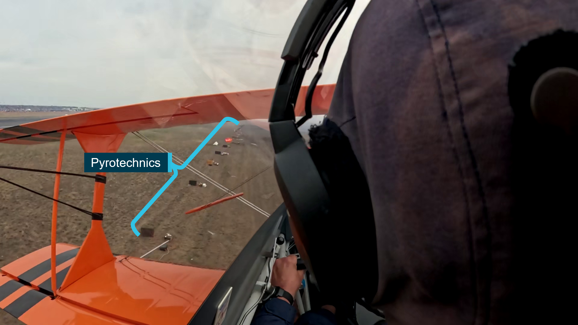 The image shows VH-PVX just prior to the collision with terrain. It shows the aircraft's proximity to the pyrotechnics which were at the accident site.