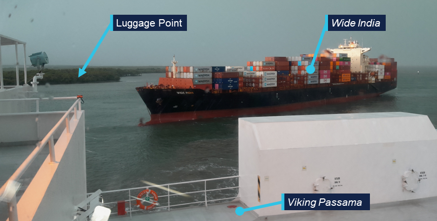 Photo taken from the bridge of Viking Passama showing Wide India approaching at close range, Luggage point is annotated in the background across the river.