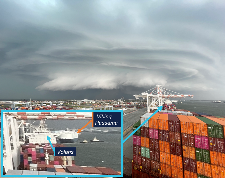Photo taken from the bridge of Wide India, a severe storm is approaching from the south. An insert shows a magnification of Volans just ahead of Wide India and Viking Passama's tugs pulling back on their lines.