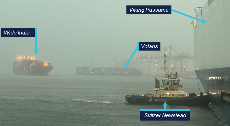 Photo taken from tug Bullara, showing  the tug Svitzer Newstead pushing up against Viking Passama's port side on the right. Wide India is seen passing Volans in the background.