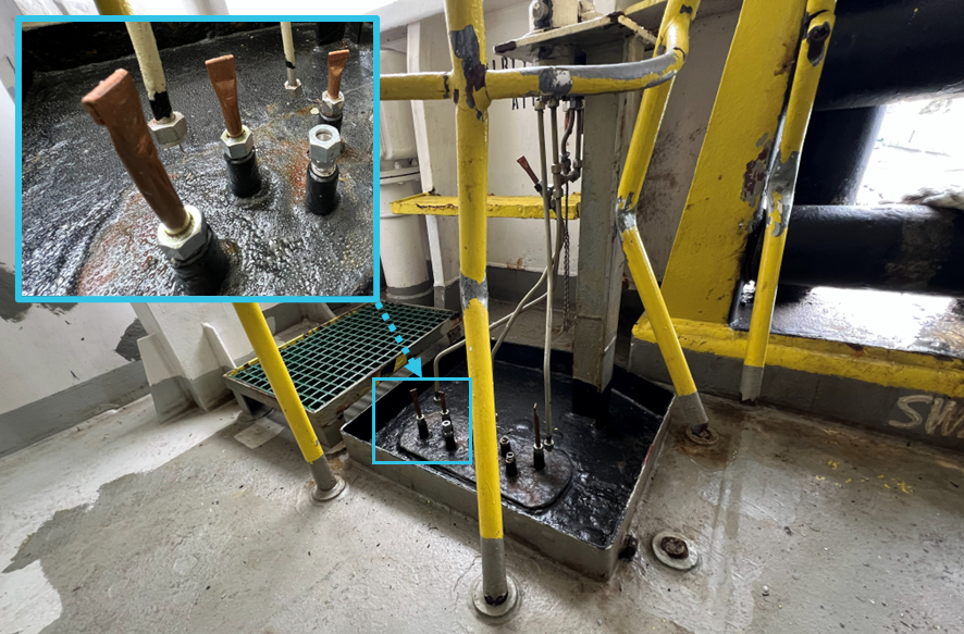 Photo showing damage to protective cage and emergency repairs to hydraulic lines on Viking Passama's starboard aft mooring station.