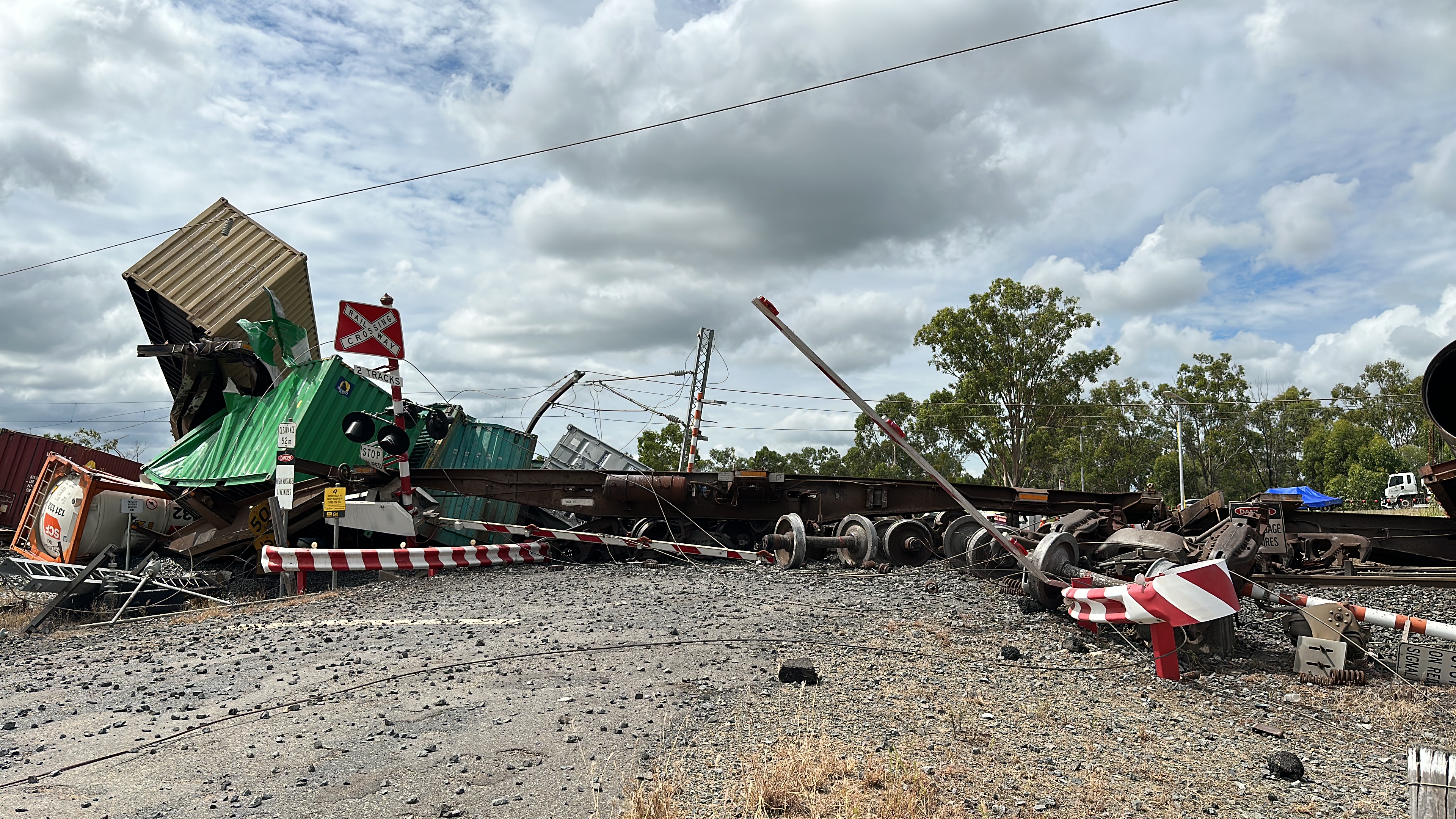 Main wreckage of train 82P7, showing damage to level crossing equipment and wiring stanchions. 