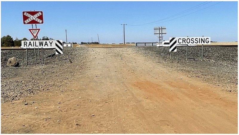 Photograph of the road vehicle approach to the crossing from the north along the unsealed road.