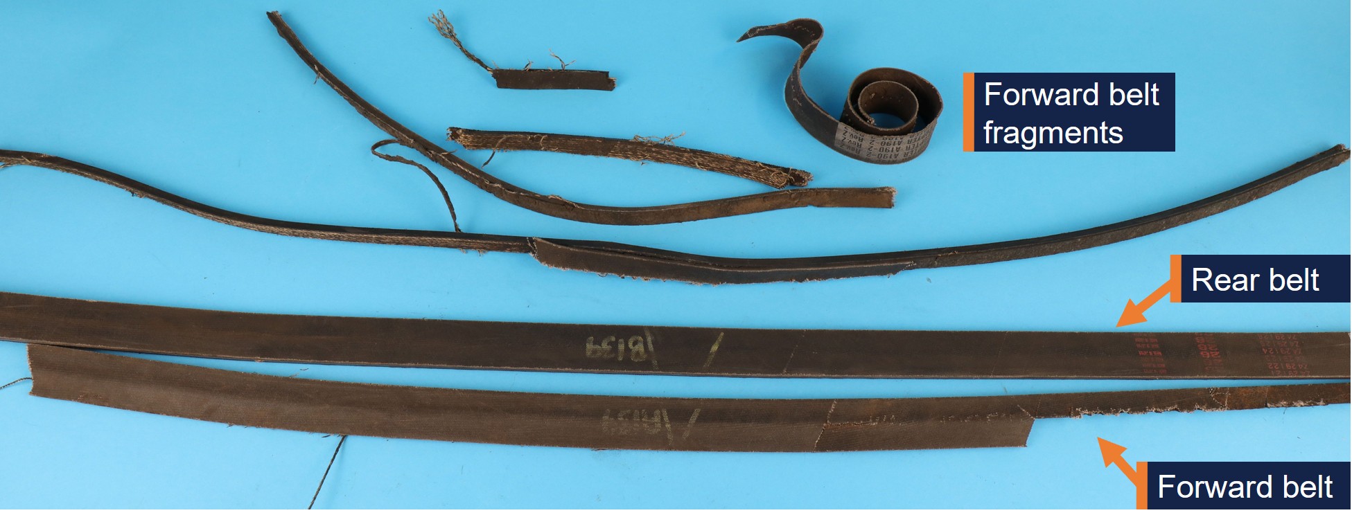 Top-down photograph showing remnants of both drive belts.