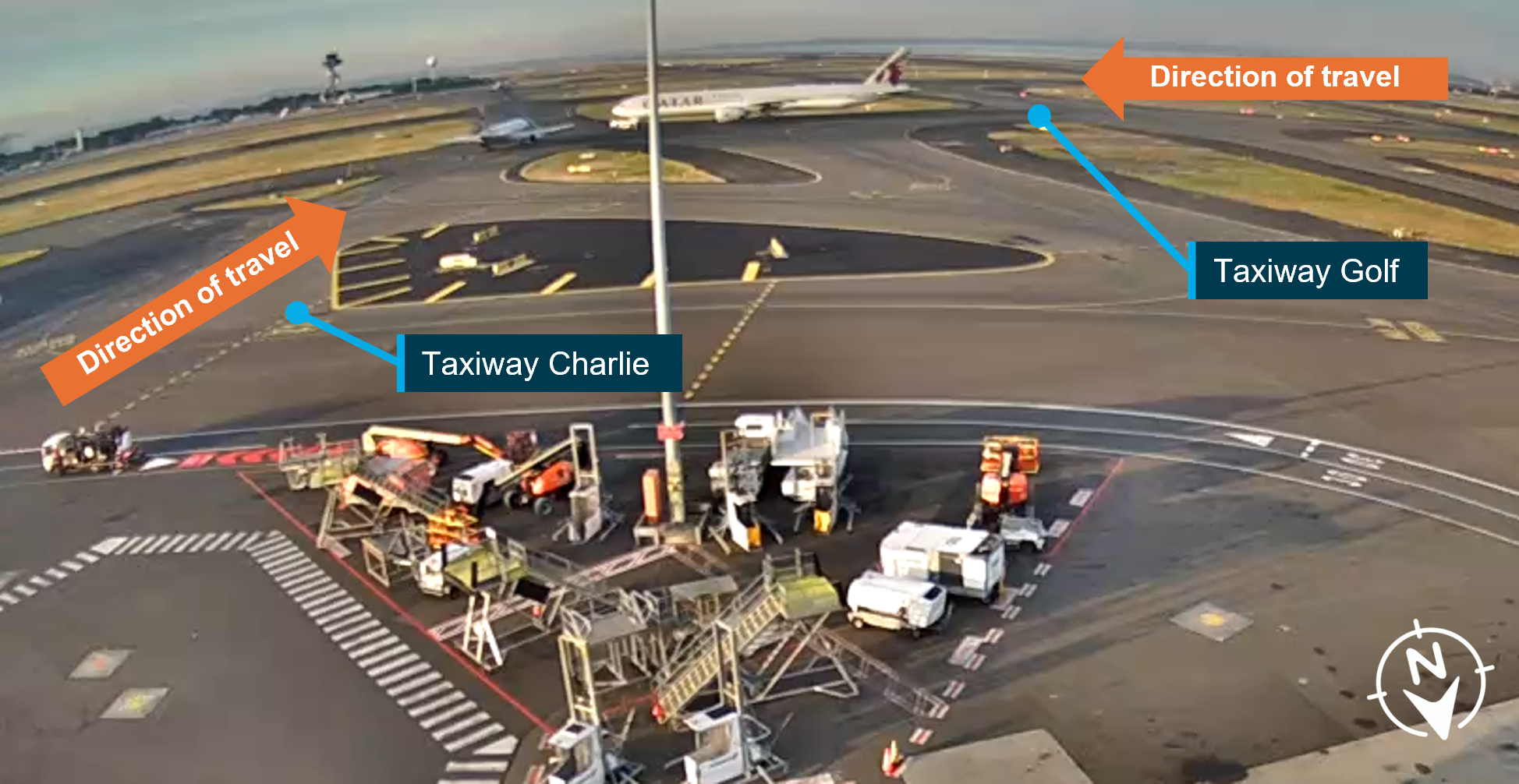Image captured from CCTV footage of the proximity of the A320 and the tug in tow with the B777 at the intersection of taxiway Golf and Charlie, as viewed from the terminal.