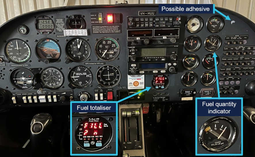 Photo of the aircraft instrument panel showing the position of the fuel totaliser, fuel quantity indicator and possible adhesive.
