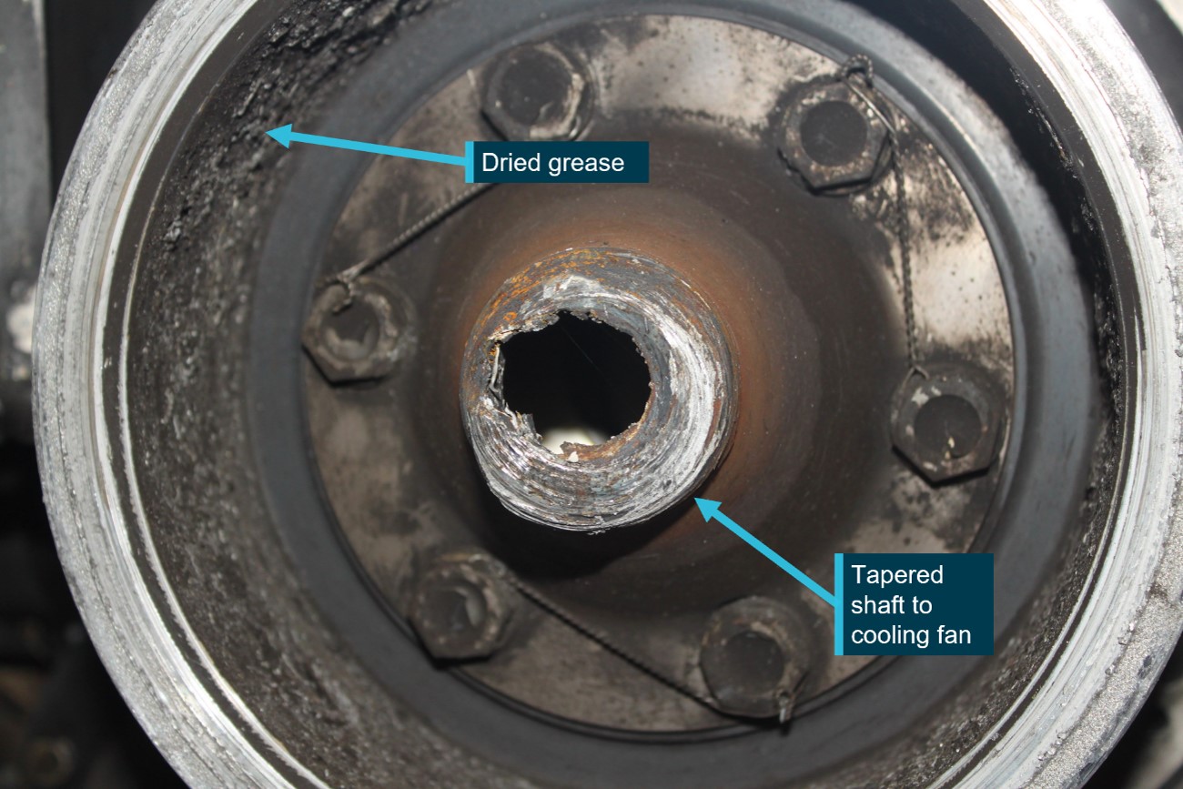 Figure 3: Lower sheave showing accumulated grease and failure of the shaft to the cooling fan