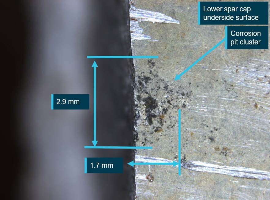 Figure 20: View of the underside surface showing a corrosion pit cluster at the fatigue crack origin