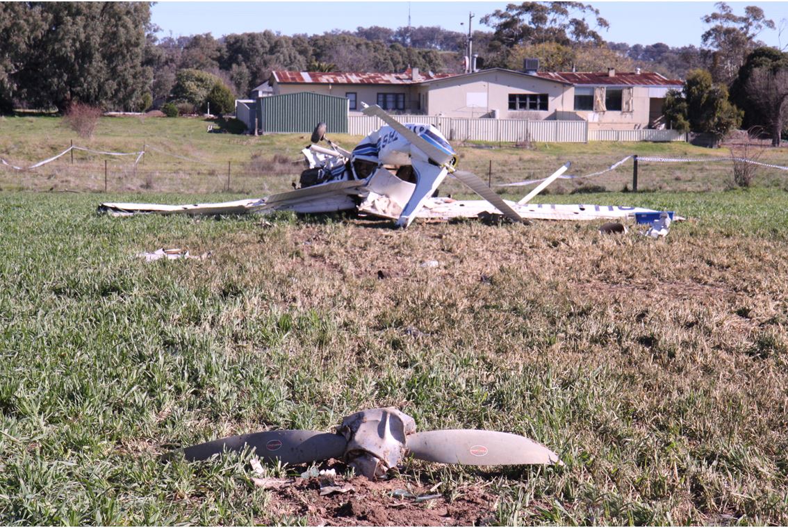Figure 2: The aircraft impacted terrain near the Farmers Inn hotel. The aircraft was inverted at impact and the propeller separated from the engine