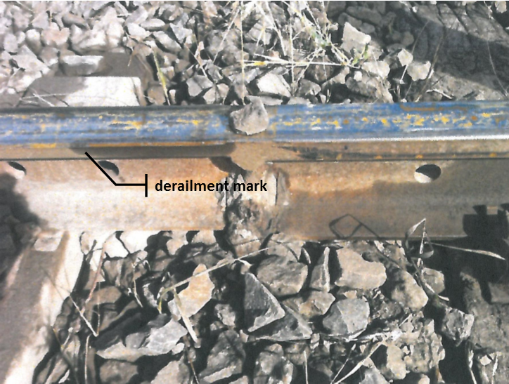 Figure 11: Photograph from the 11 September 2013 derailment, showing marks on the rail gauge face consistent with a left hand wheel dropping inside the common rail