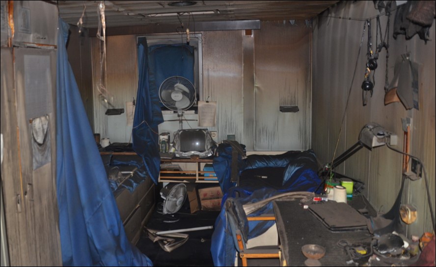 Figure 6: A two-berth cabin after the fire (note fuel load and possible ignition sources)