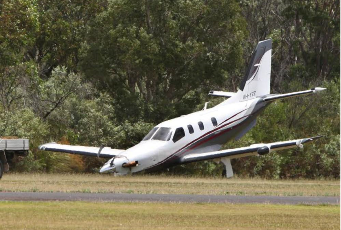 Figure 3: YZZ post-accident showing the damage to the forward section of the aircraft as a result of the nose gear collapse and skidding on the ground