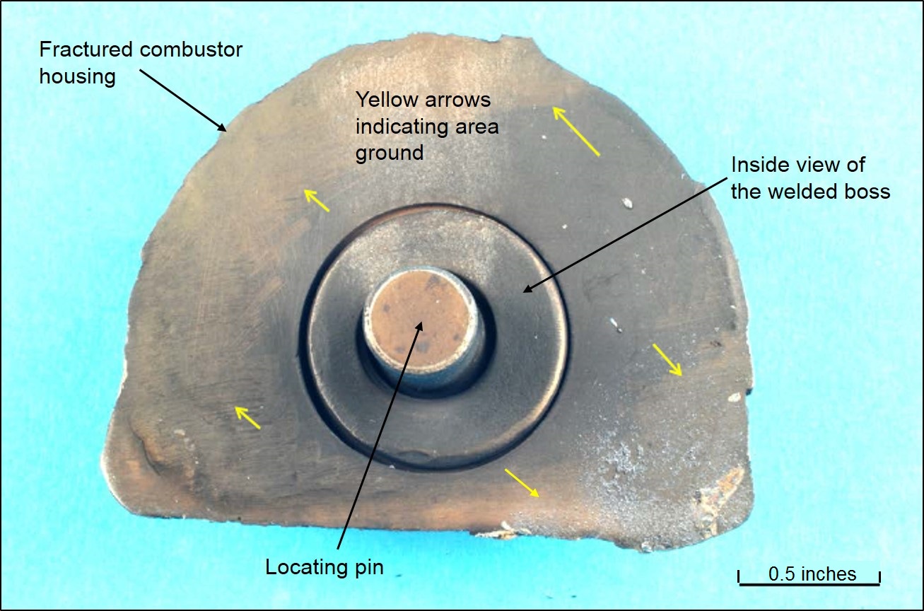 Figure 6: Image of the inner side of the fractured combustor housing and the locating pin protruding through the welded boss.