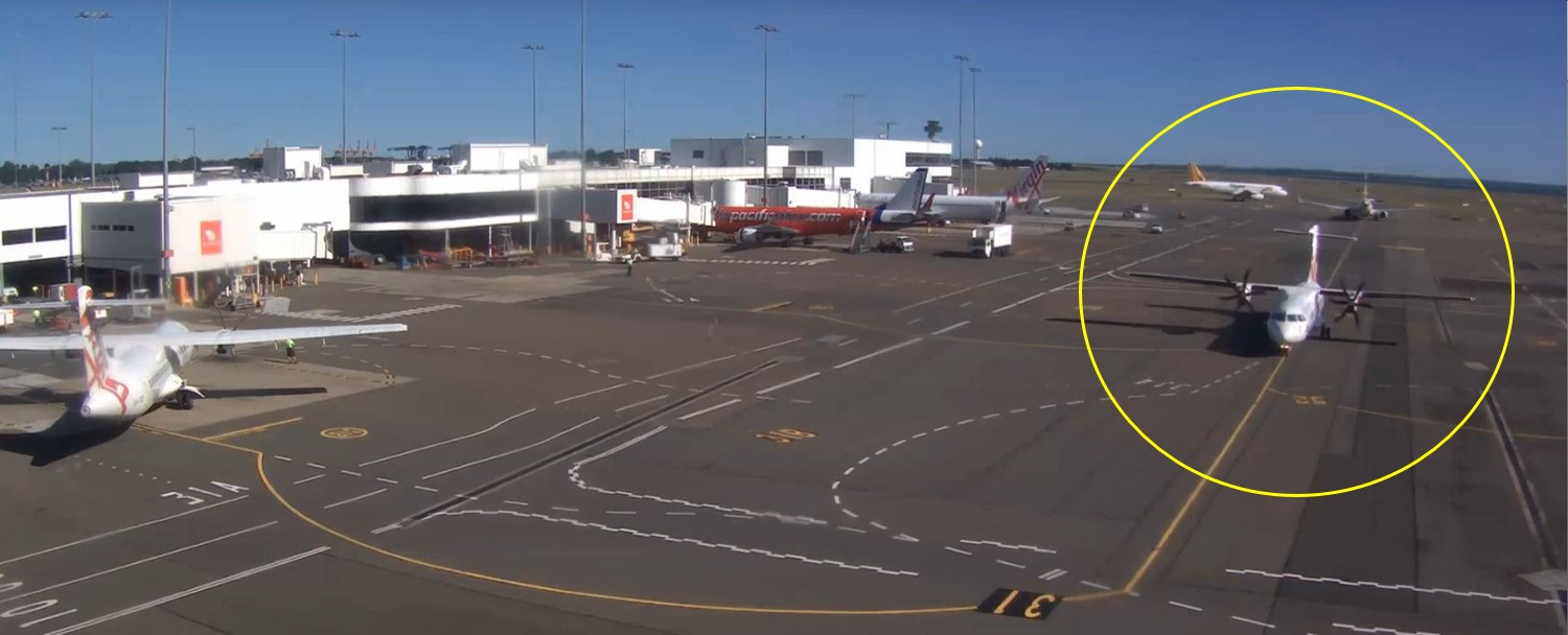 Figure 1: VH-FVR (circled) taxiing inbound at Sydney Airport on 20 February 2014 following the in-flight pitch disconnect (still image copied from closed-circuit television footage). Note the angle of the horizontal stabiliser relative to the wings
