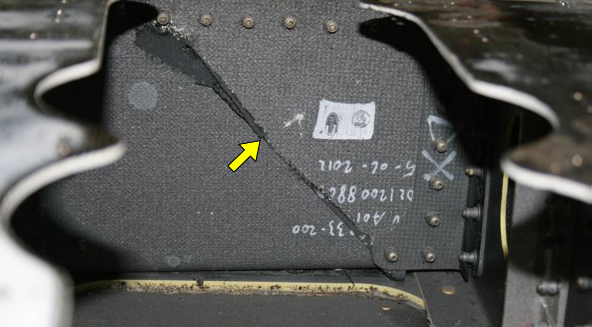 Figure 8: Crack in the horizontal stabiliser front spar. The diagonal crack in the spar web is identified by a yellow arrow
