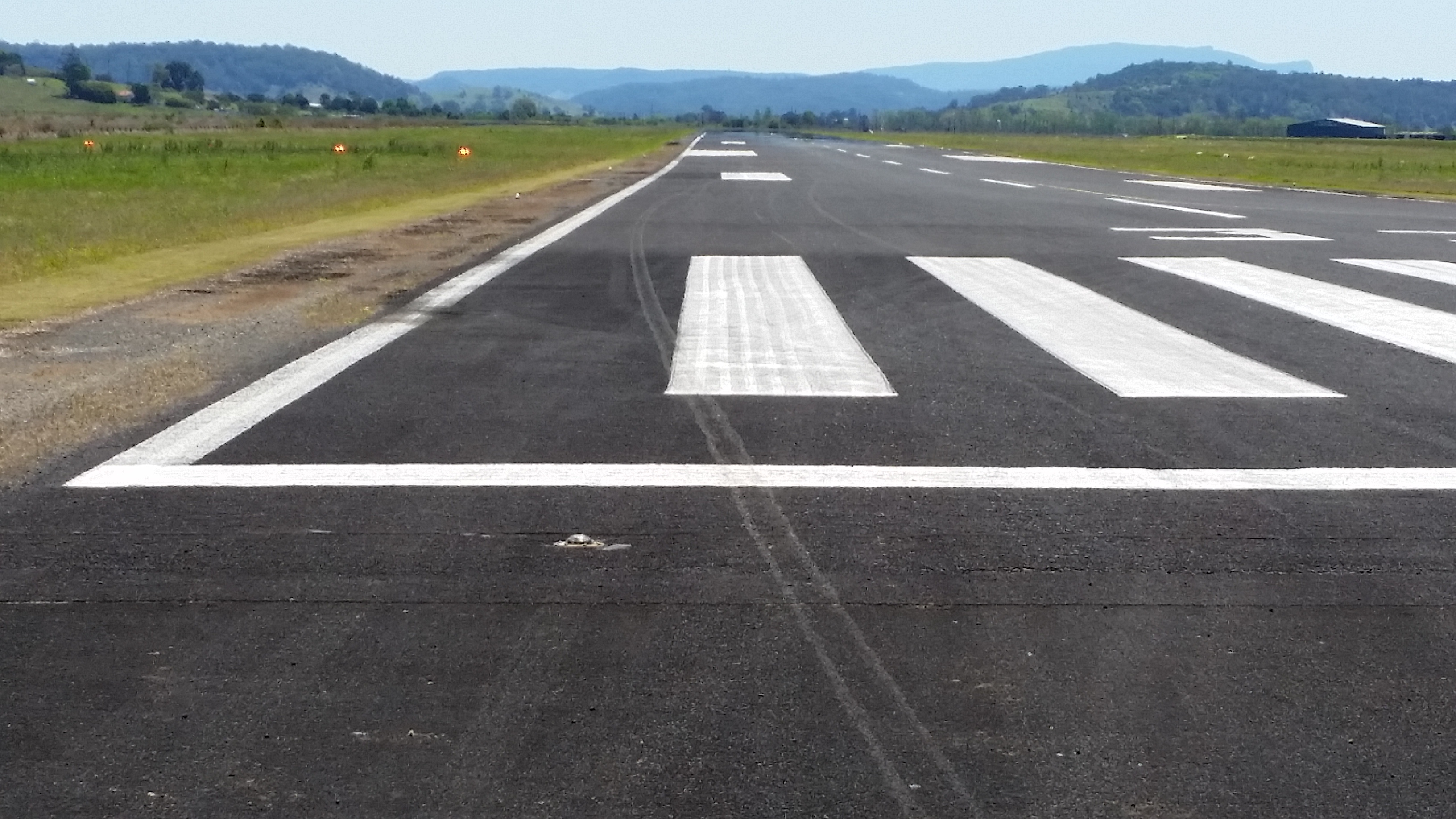 Figure 5: Southeast end of the runway showing right wheel contact marks on the runway and their position in relation to the runway centre line. Source: Aircraft owner