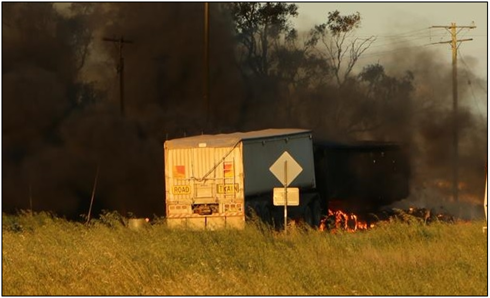 Figure 8: Post-collision fire, road-train truck (trailers) at Tullamore – Narromine Road railway crossing