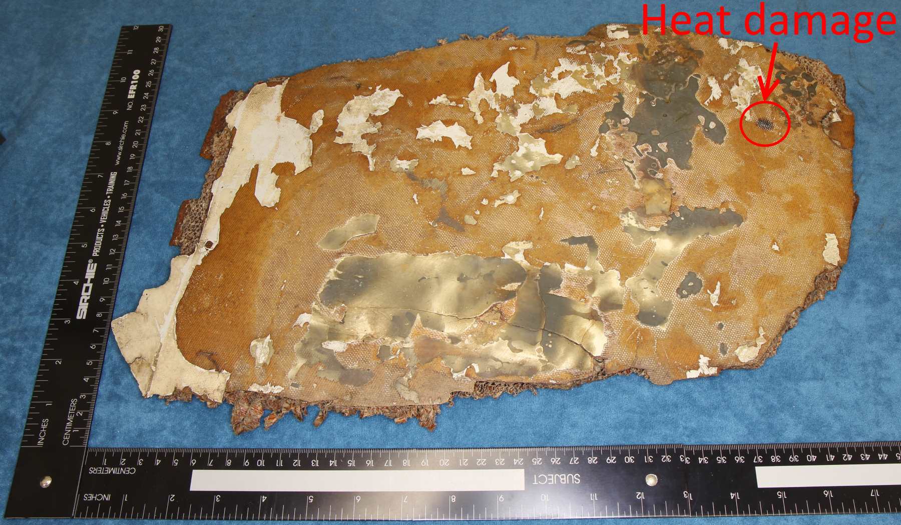 Larger composite panel showing discrete area of heat damage