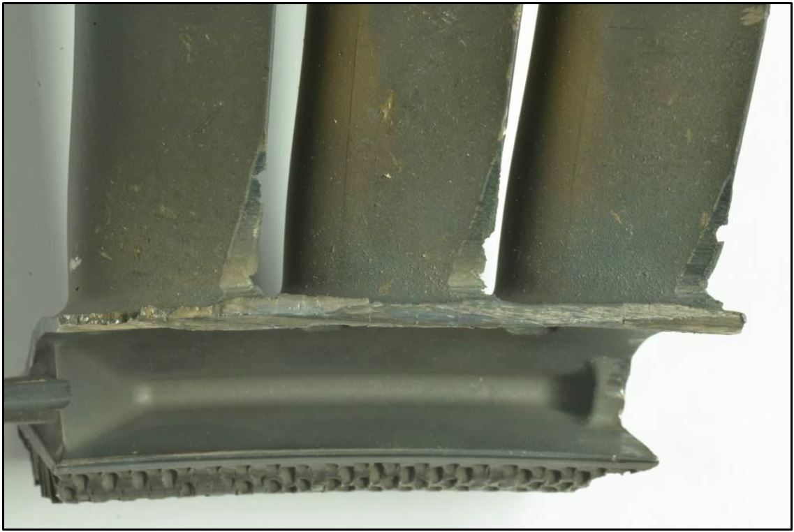 Figure 12: Stage four low pressure turbine vane cluster showing clashing damage to the inside diameter of the shroud and aerofoils