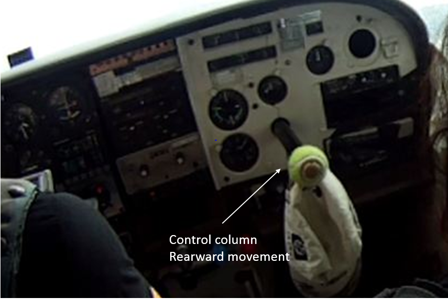Figure 9: VH-FRT in flight on 8 February 2014 with the copilot’s control column protruding out of the control panel